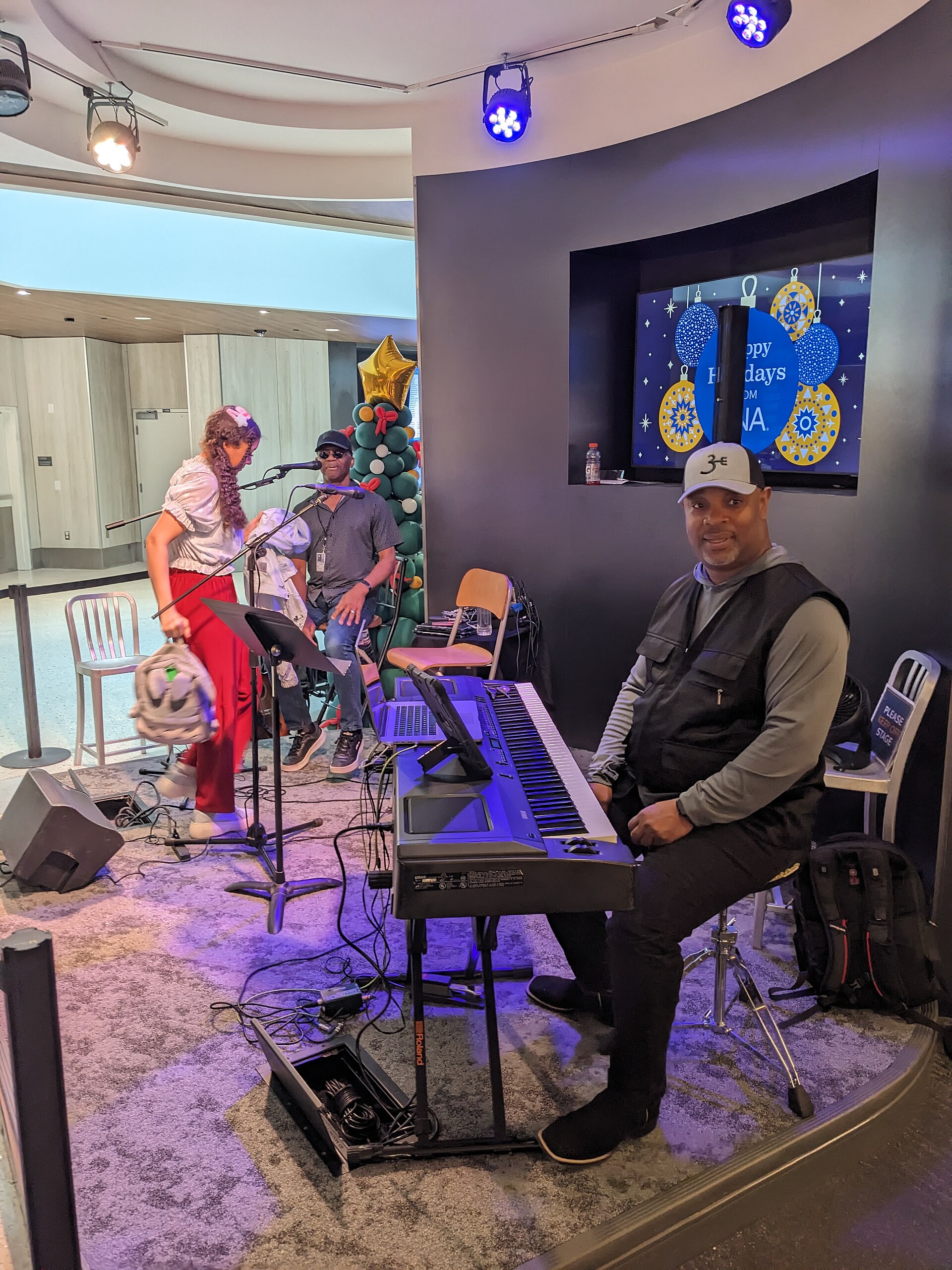Joe West and his group perform at Nashville International Airport on New Year's Eve in Nashville, Tennessee.