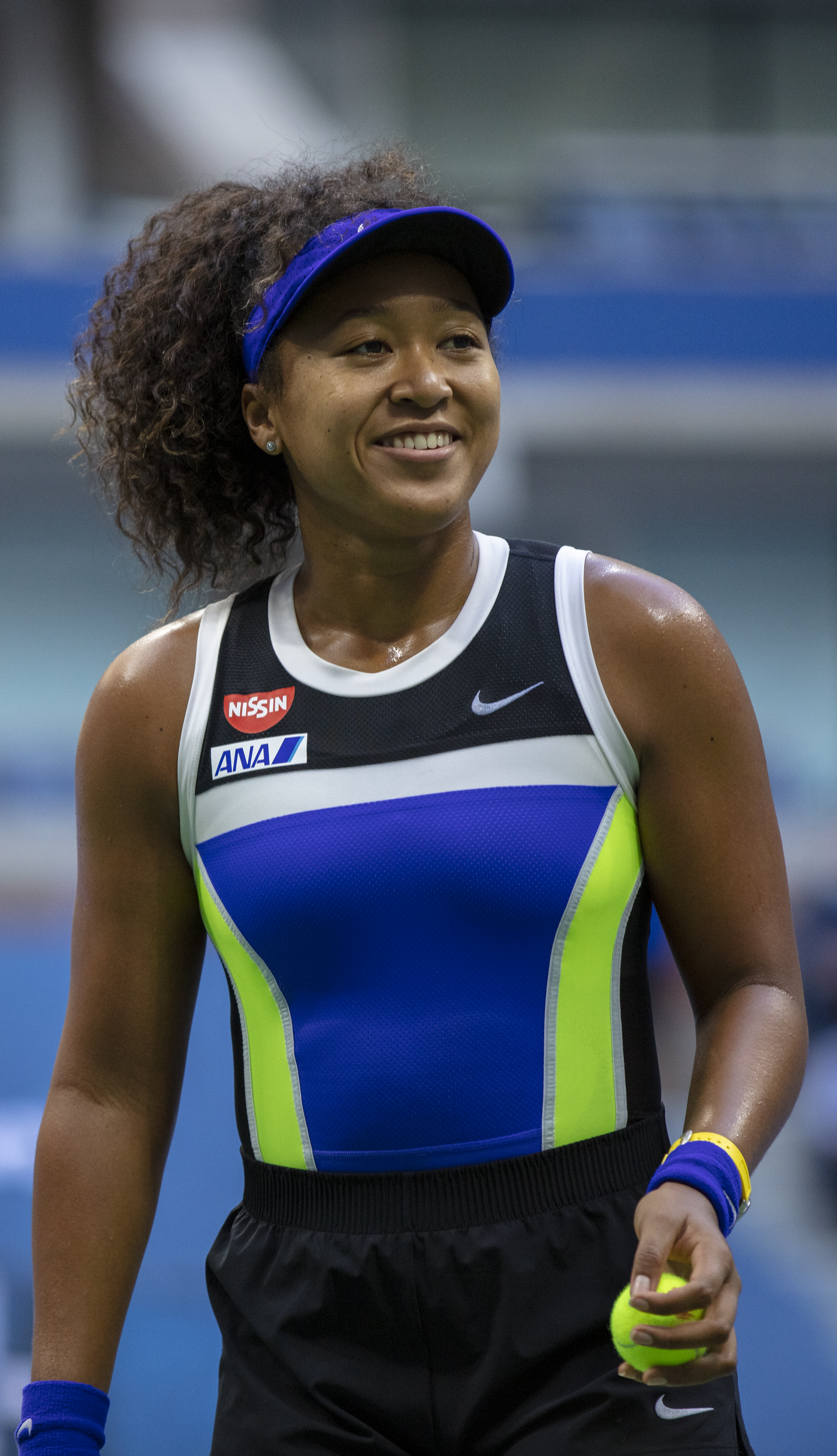 Naomi Osaka smiles during her match against Azarenka in the 2020 US Open Finals hosted in Arthur Ashe Stadium on the grounds of the USTA Billie Jean King National Tennis Center.
